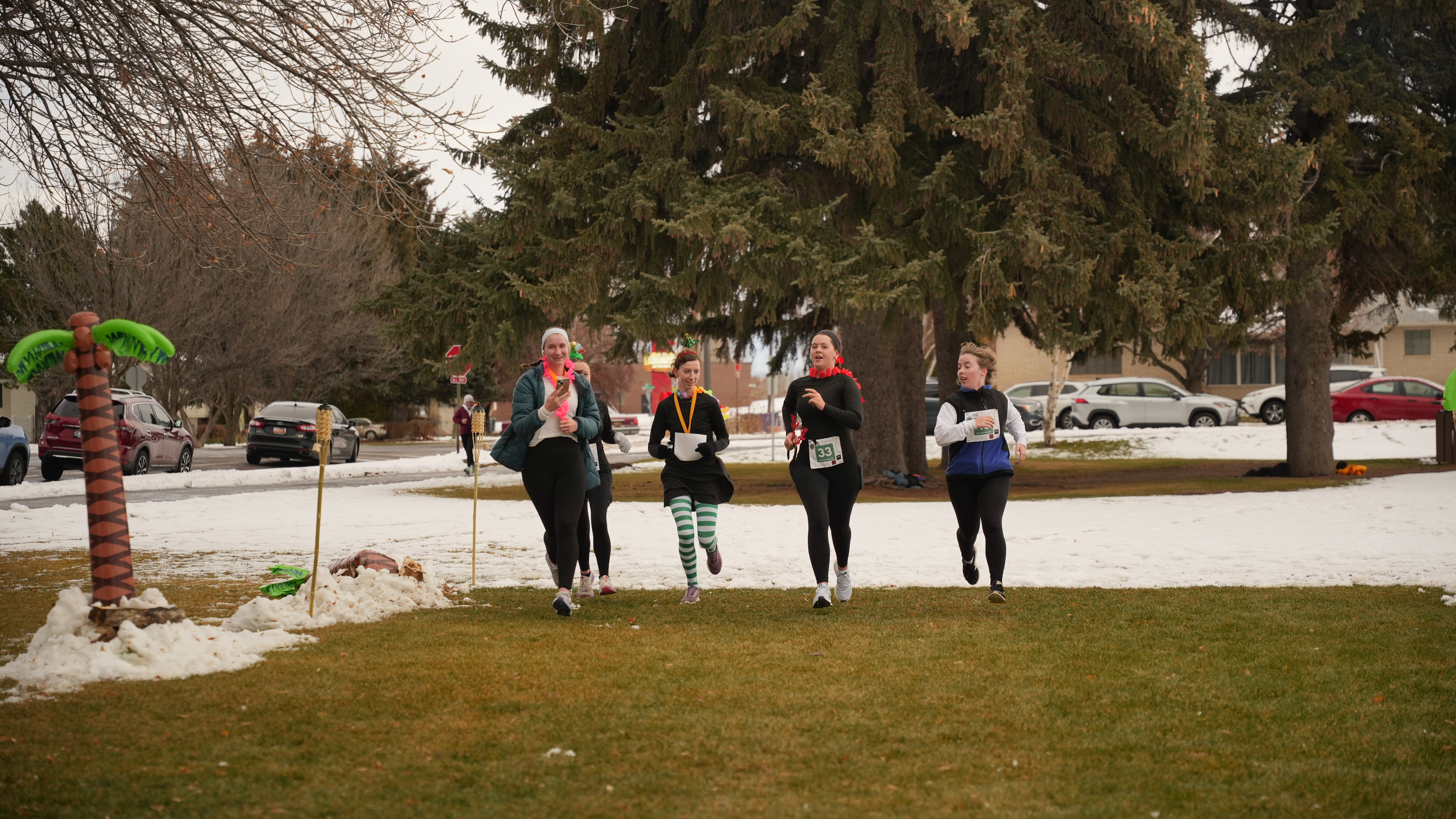 four people finishing together