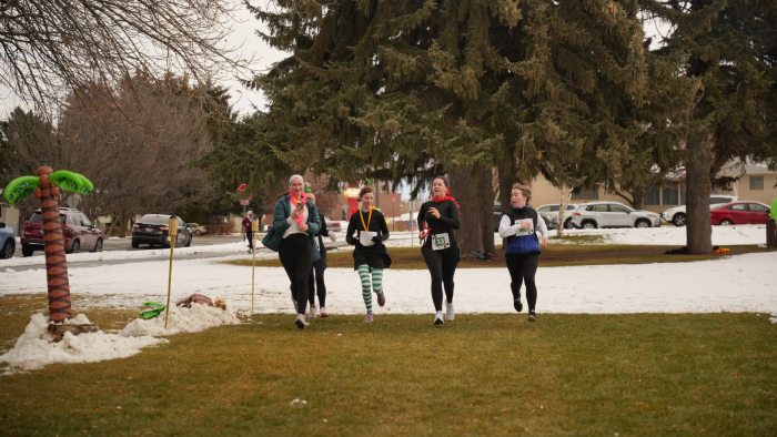 four people finishing together