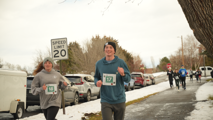 people running in a group but closer